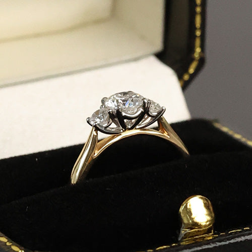 Close up of three stone engagement ring