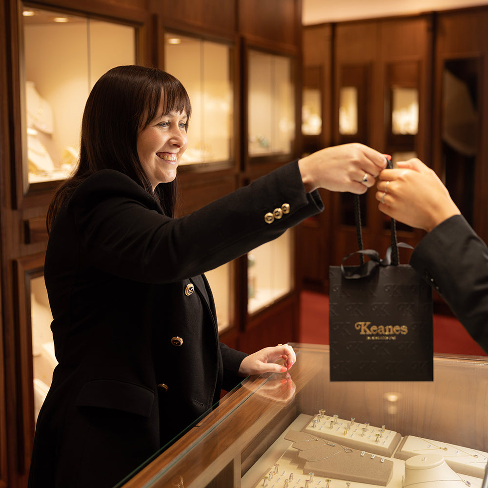 Staff member handing bag to someone